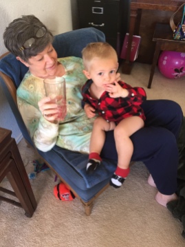 Mimi indulging Levi in some cranberry juice